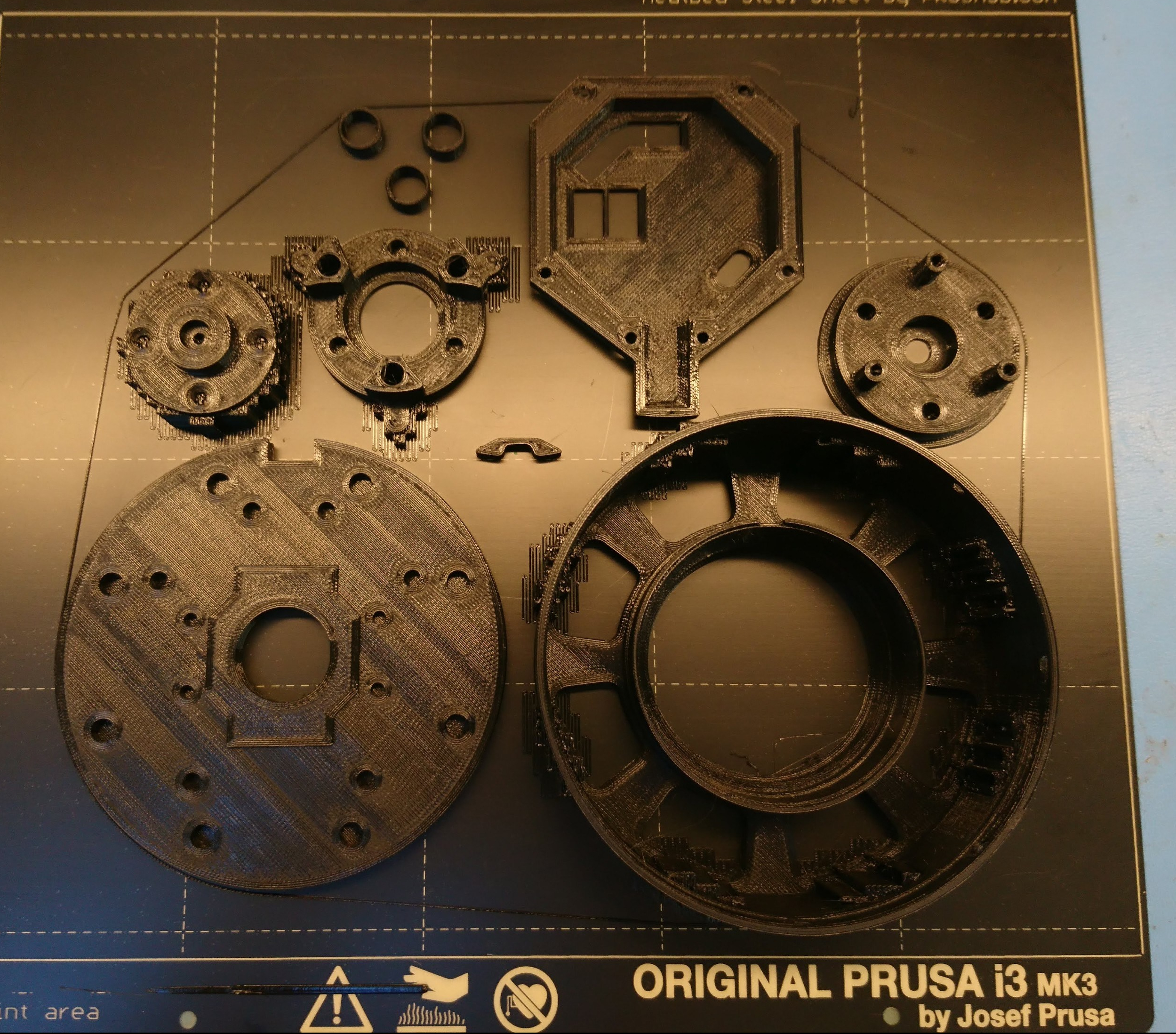 Plastic gearbox parts on build plate