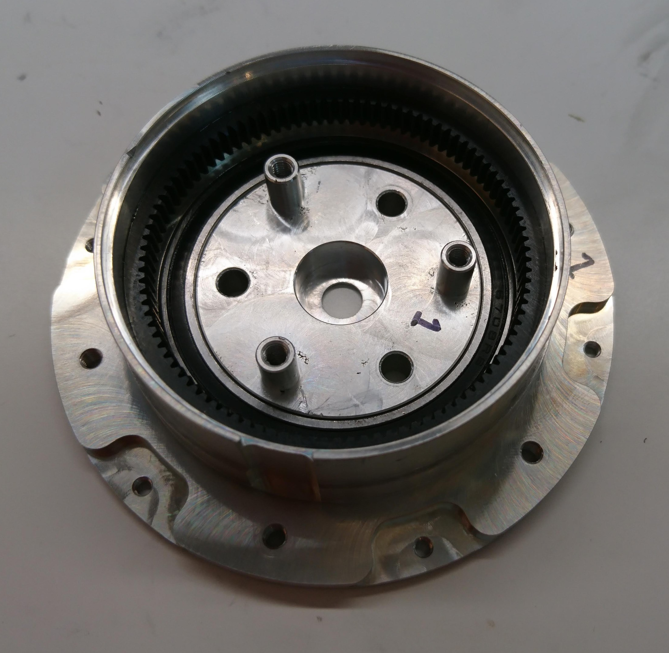 Front housing with internal gear, output bearing, and planet output