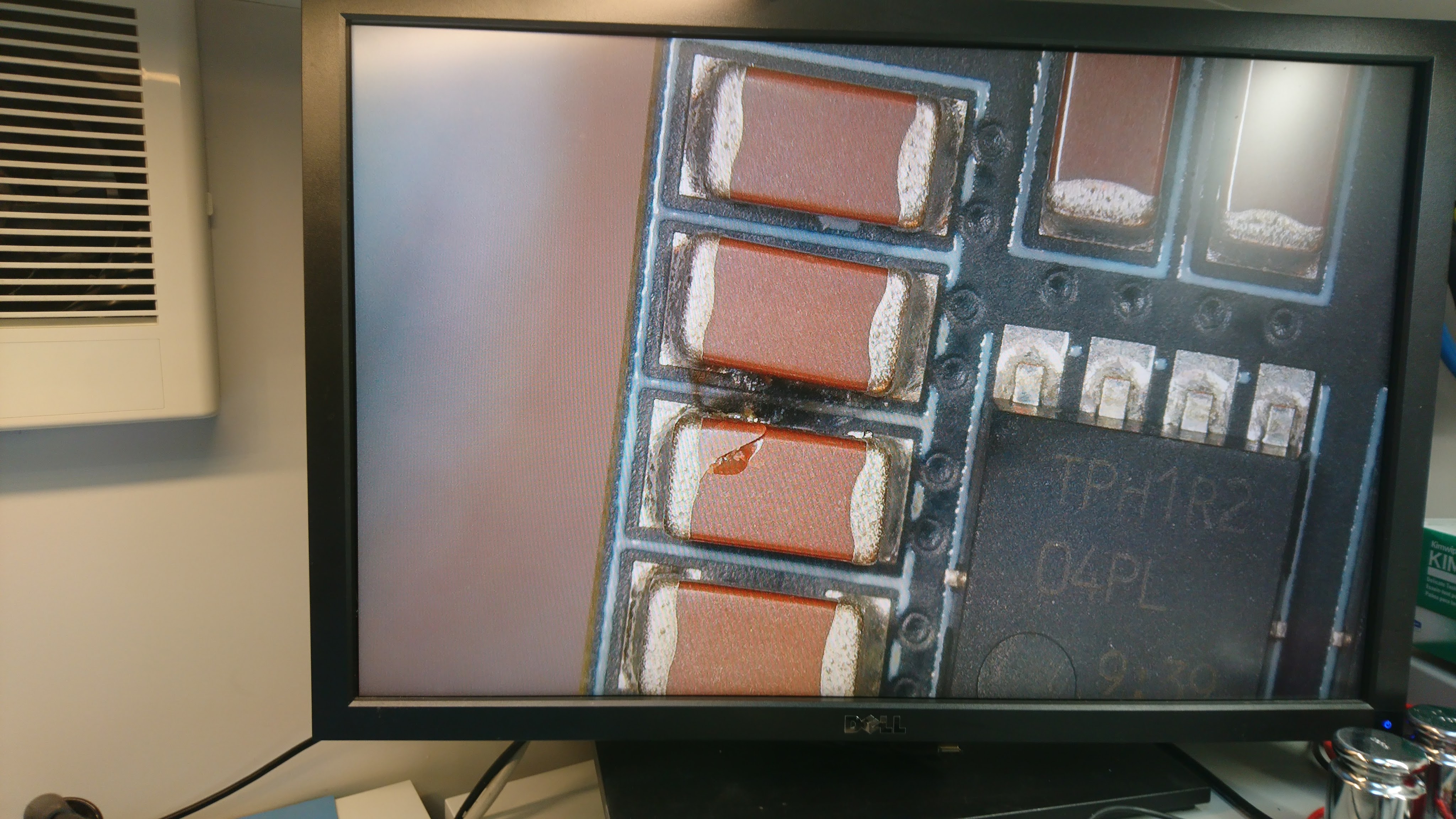 A very obviously cracked capacitor