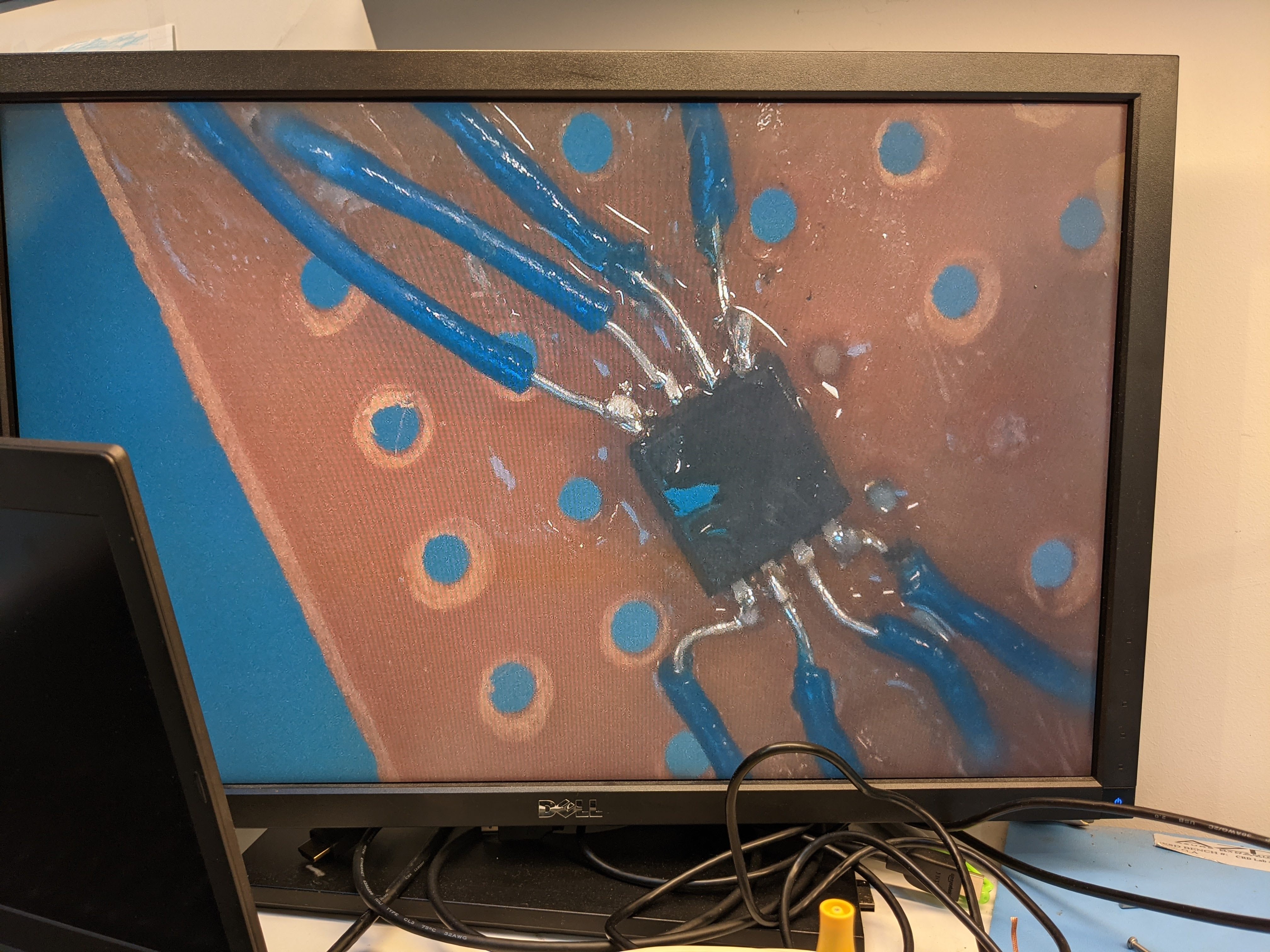 The charge pump wired up under the microscope