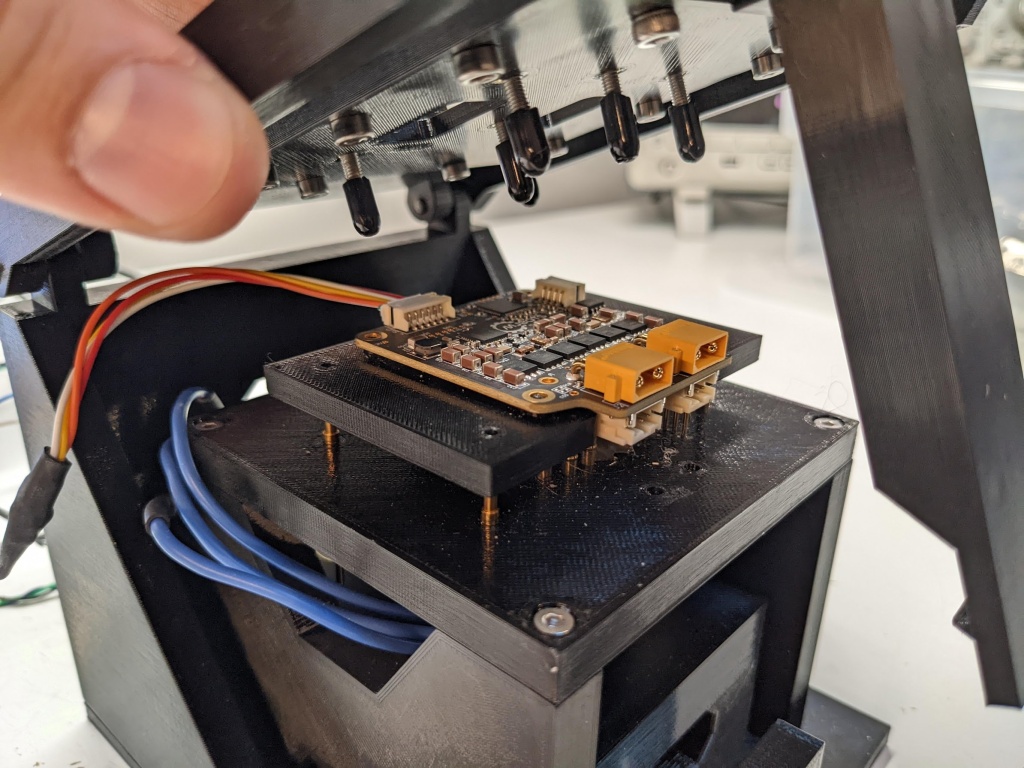 Lid raised, showing board contacts